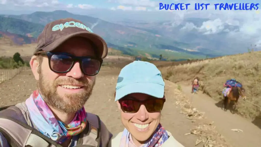 Couple halfway up Acatenango Volcano on Wicho & Charlie's Acatenango Overnight Hike, donkey in background