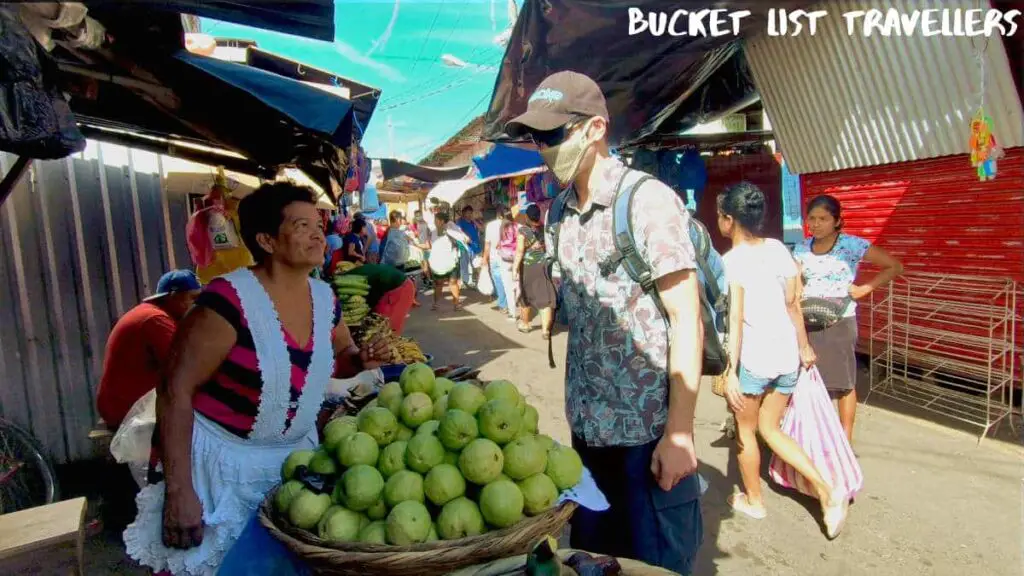 Woman selling guavas at Mercado Municipal Granada Nicaragua