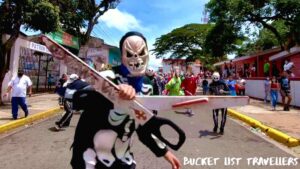 La Muerte Quirina at Tope de los Santos Jinotepe Nicaragua, skeleton holding scissors