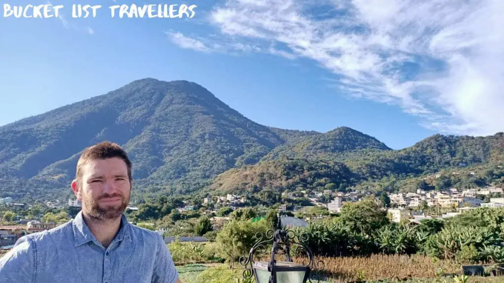 Man at San Pedro Lake Atitlan, Volcan San Pedro in background