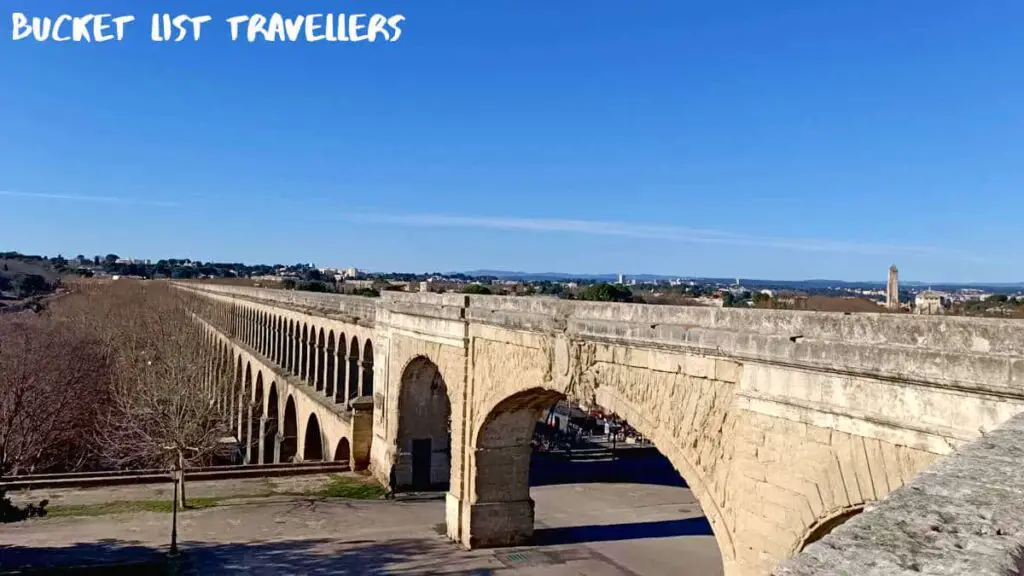 Aqueduc Saint-Clément Montpellier France, Aqueduct in France, Blue sky, leafless trees