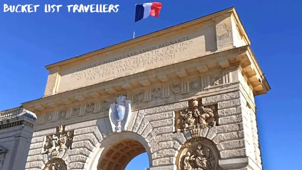 Arc de Triomphe Montpellier France, Triumphal Arch wtih French flag on top, Porte du Peyrou