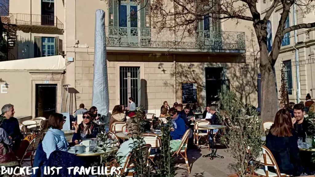 Outdoor dining at Place d'Assas Nîmes France, French cafe