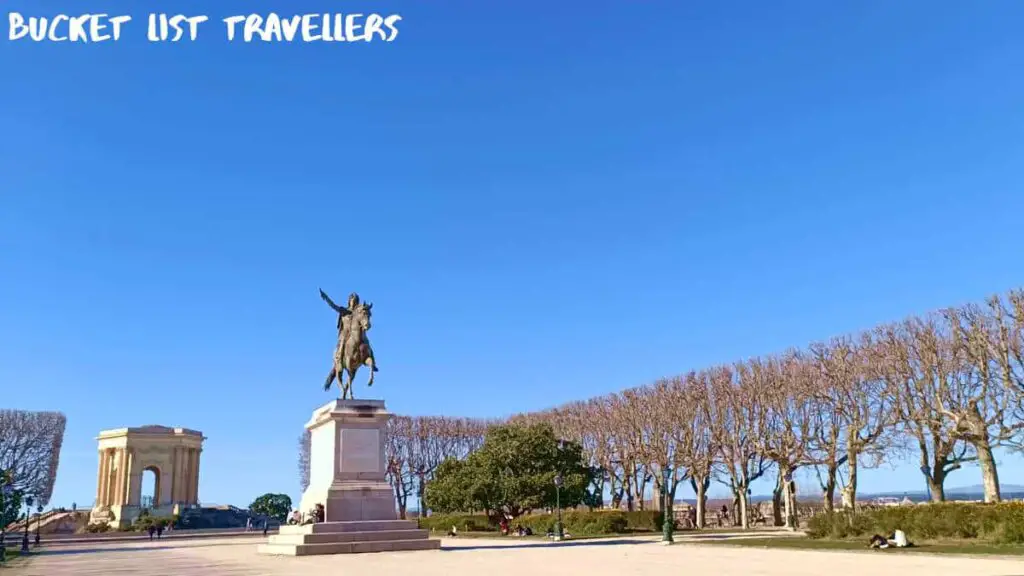 Statue équestre de Louis XIV at Promenade du Peyrou Montpellier France, tree-lined French square on sunny winter day