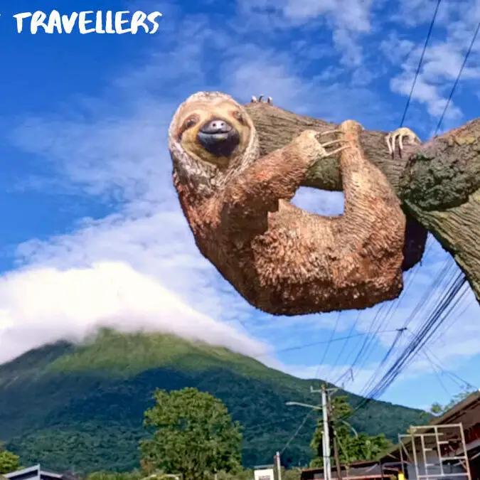 Sloth Statue in front of Volcan Arenal at La Fortuna Costa Rica