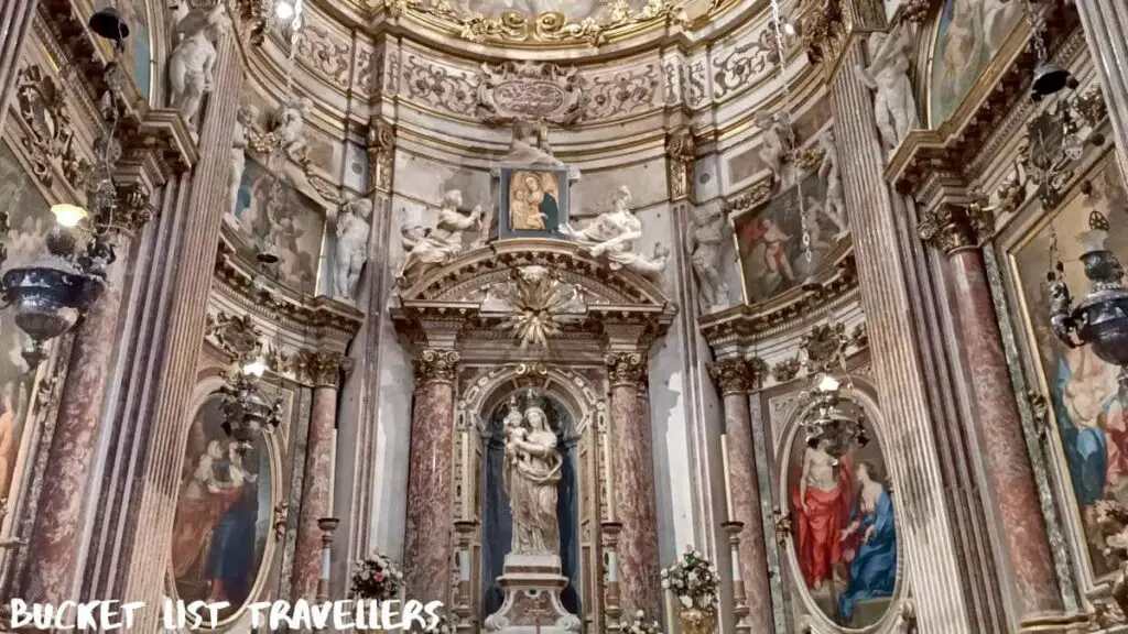 Inside Basilica di San Siro Genoa Italy, statue of Mary holding Jesus