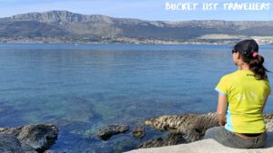Sitting at Lubinski Porat Beach Split Croatia