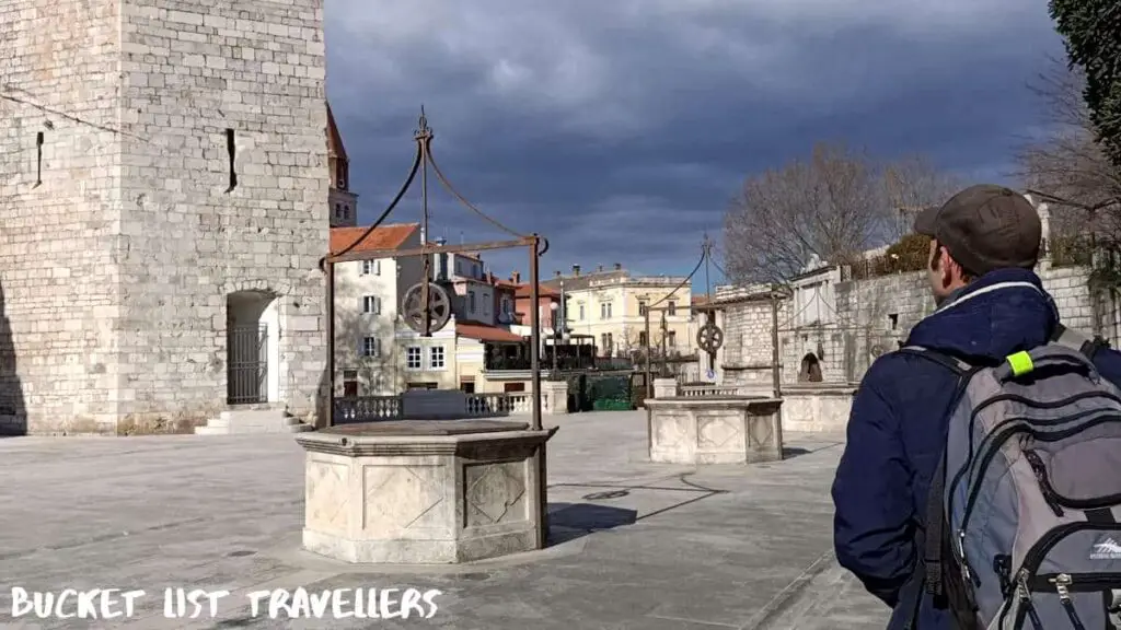 Man walking at The Five Wells Square Zadar Croatia