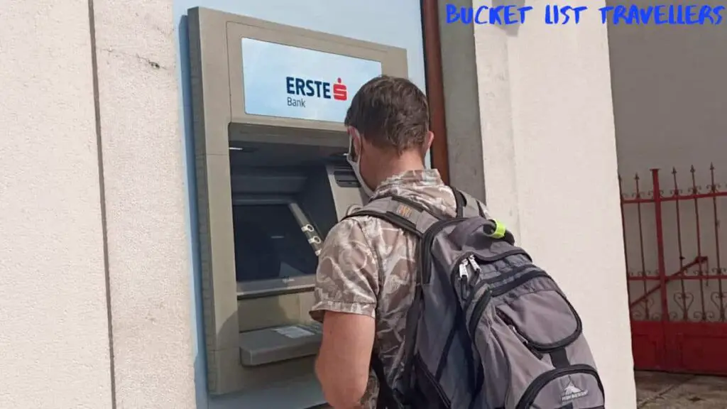 Man using ATM in Kotor Montenegro