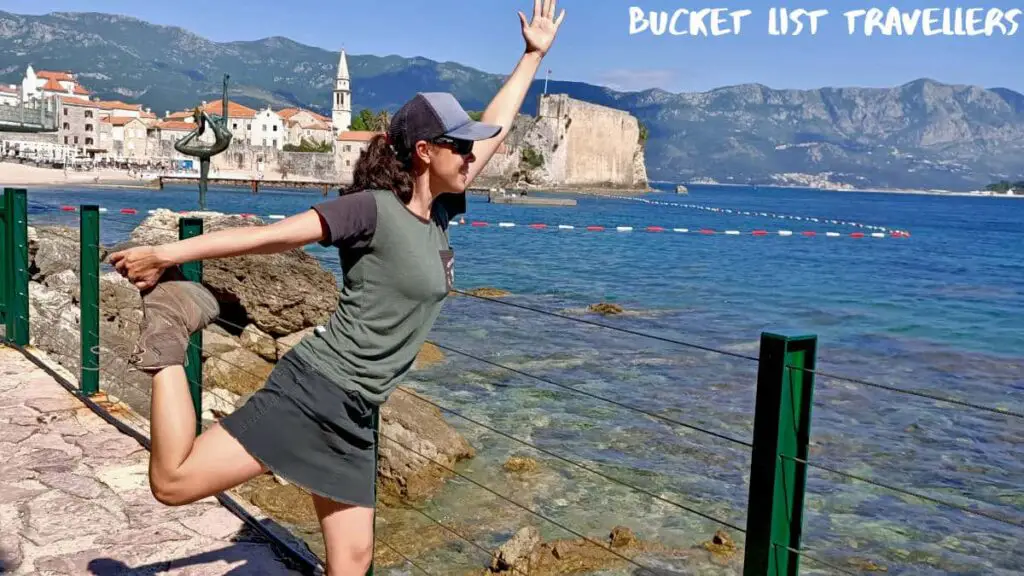 Woman doing Yoga Pose in front of Budva Dancing Girl Statue Budva Montenegro