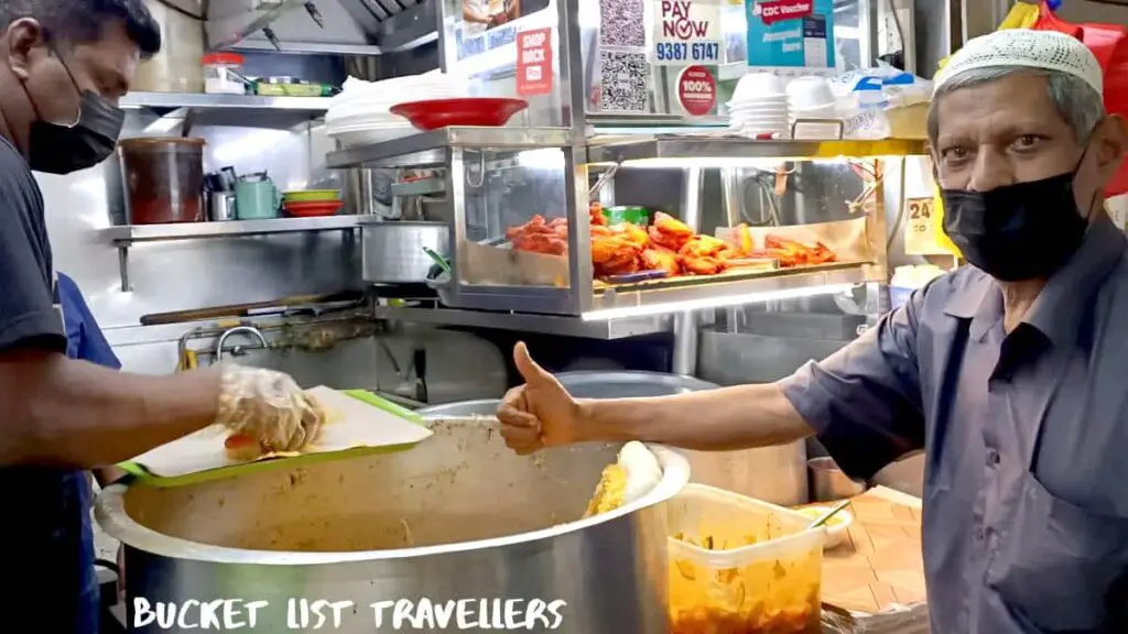 Ar Rahman Royal Prata - Tekka Centre Hawker Centre Singapore, man giving thumbs up sign