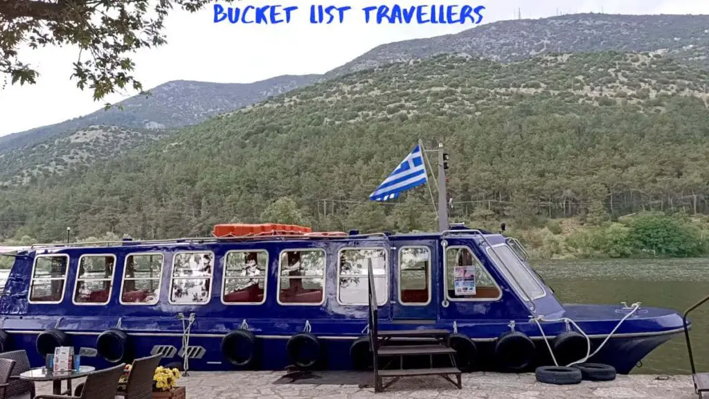 Ferry at Ioannina Island Greece, Greek flag