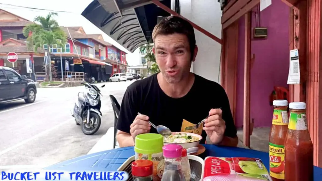 Man Eating Mee Ayam-Restoran Mee Ayam Kampung Haji Lie Kuala Besut Malaysia