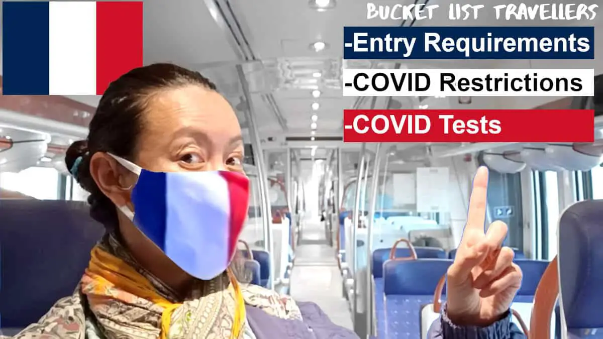 Woman wearing mask in train in France, pointing to the words "Entry Requirements", "Covid restrictions" and "Covid tests", French flag