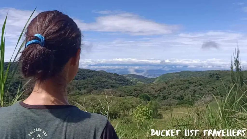 View over woman's shoulder at Mirador Valle Escondido Preserve Monteverde Costa Rica