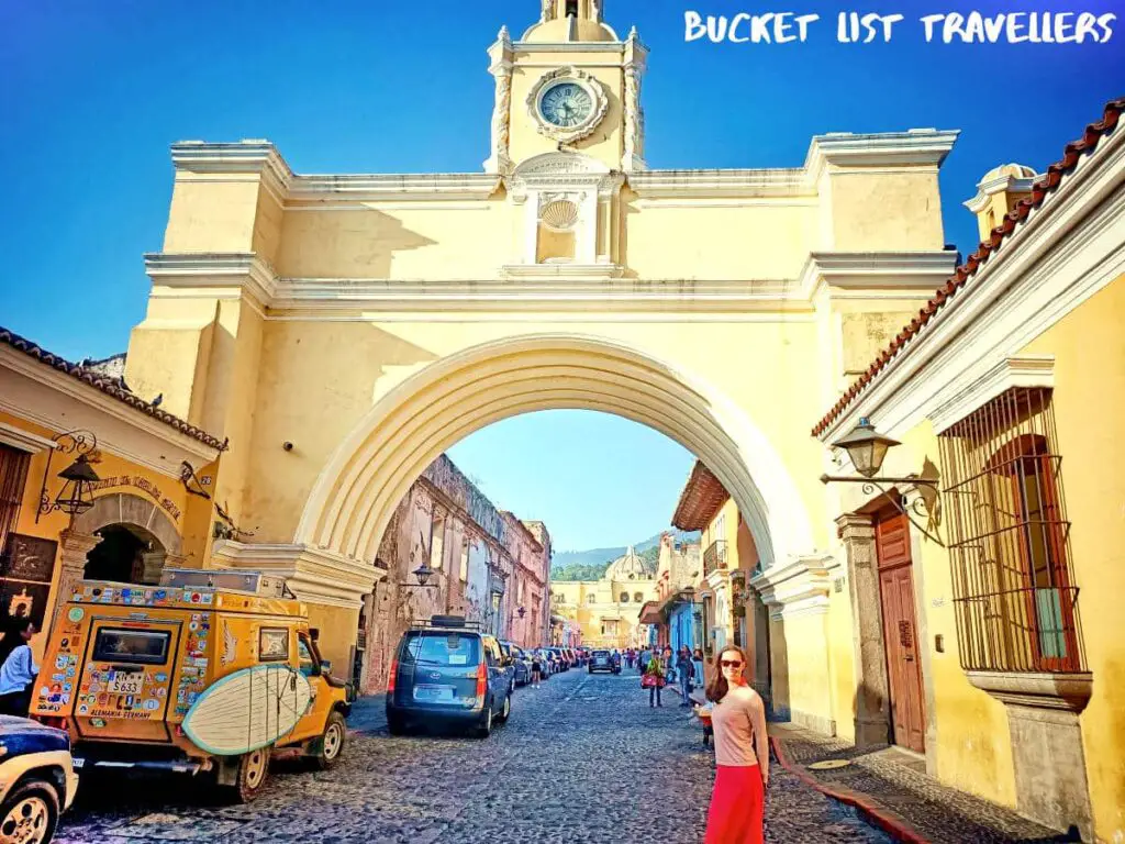 Woman Standing In Front Of Santa Catalina Arch Antigua Guatemala