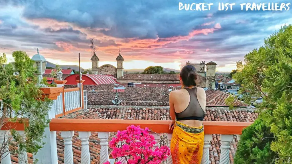 Woman on Balcony of Hotel La Gran Sultan Granada Nicaragua at Sunset