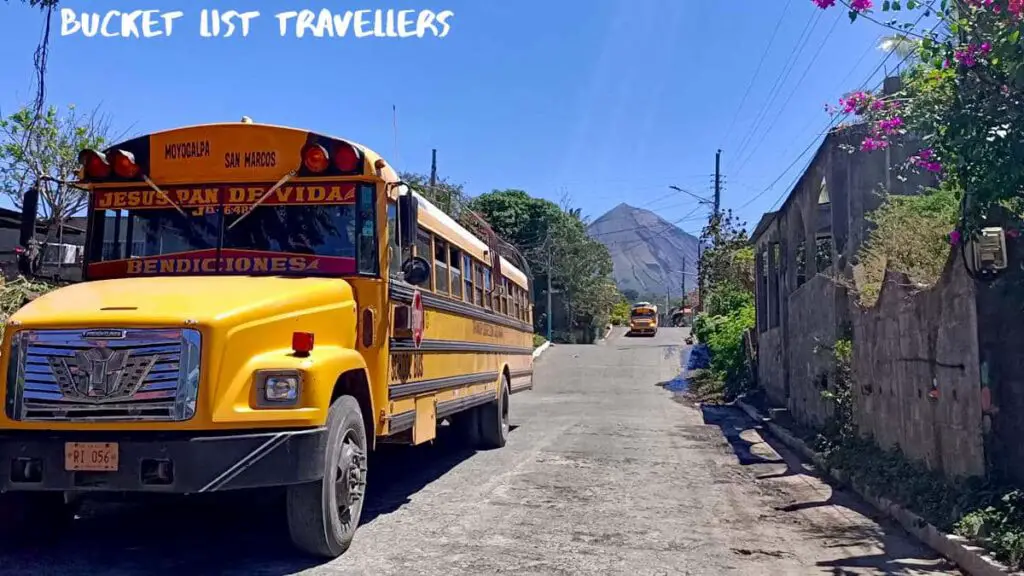 Bus-Moyogalpa Ometepe Island Nicaragua, Yellow bus with Volcan Concepcion in the distance