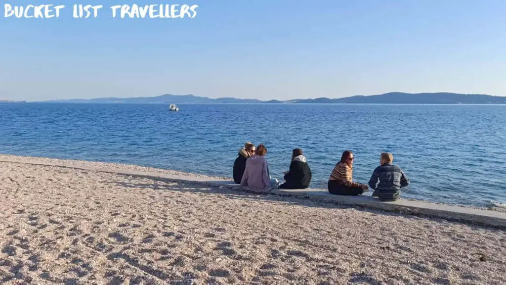 Sitting by the water at Kolovare Beach Zadar Croatia